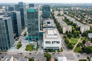 צילום אוויר של מרכז עסקים חדיש לצד שכונת מגורים.